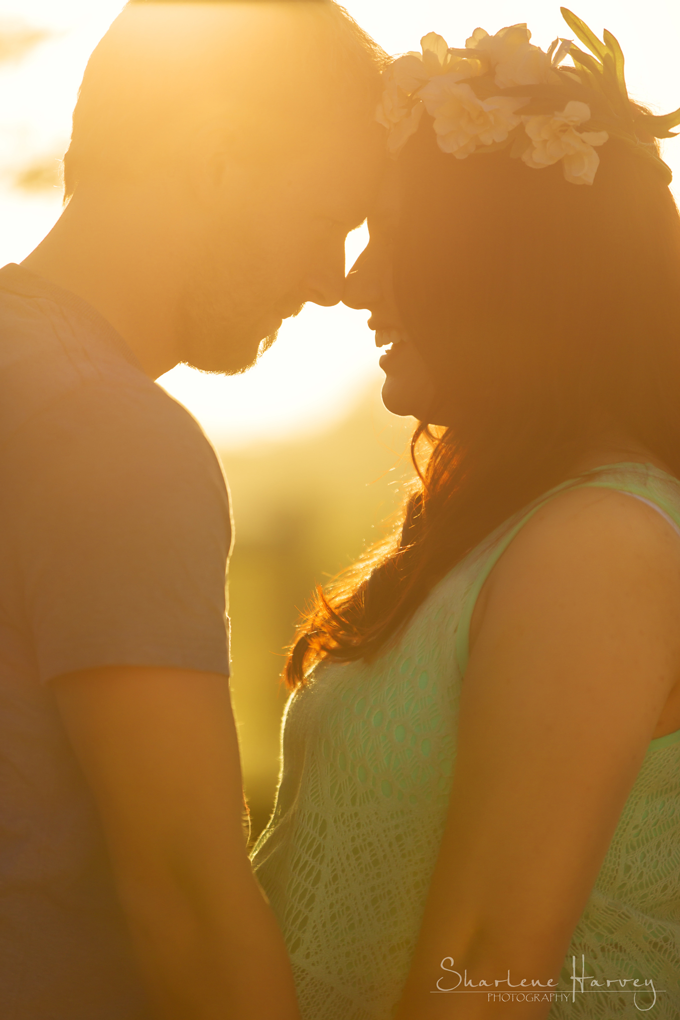 Parents-to-be gaze into each others others | Pregnancy Photographer