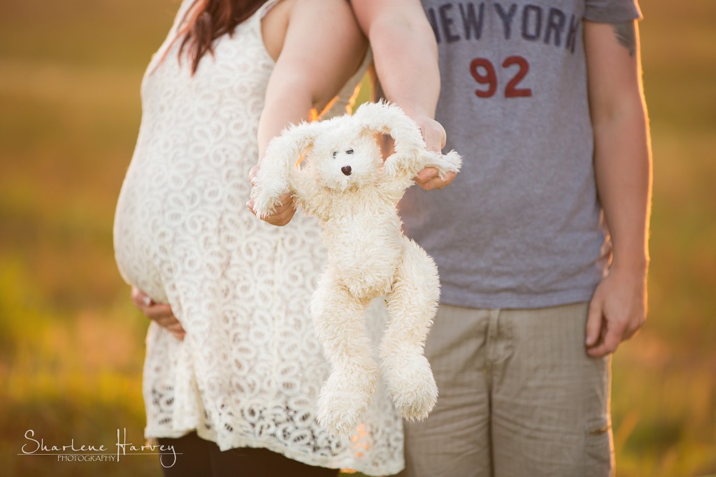 Parents-to-be hold up baby's bunny - Pregnancy Portaiture Mornington Peninsula